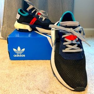 Black adidas with orange/blue accents.